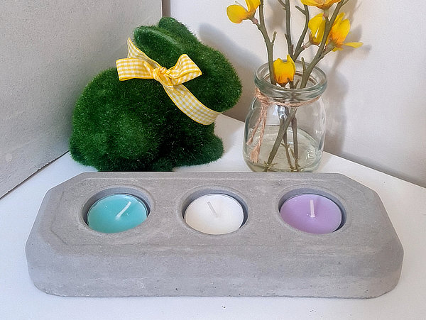 A Photo of a Concrete Trio Tea Light Candle Holder